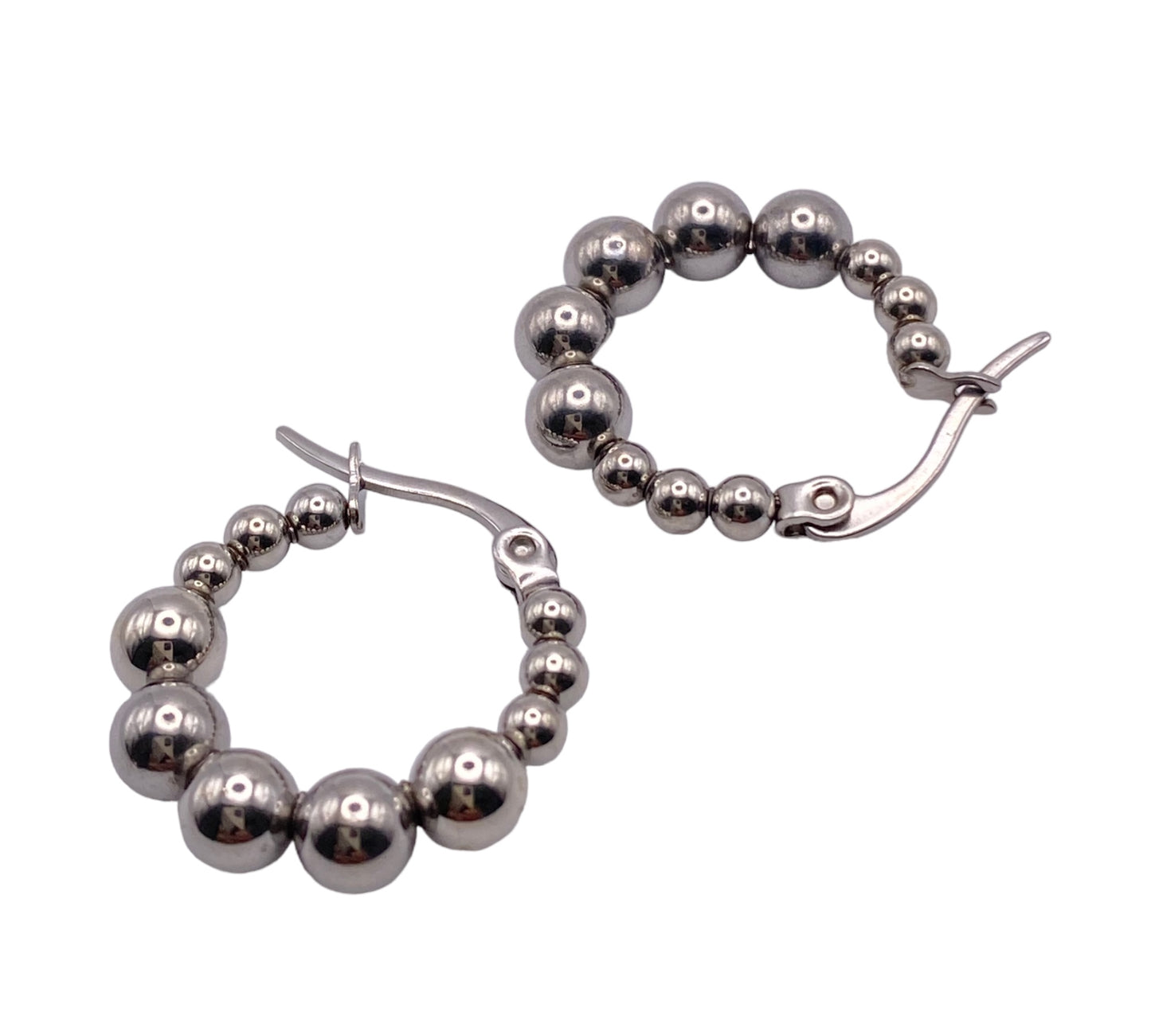 "VERDI" silver colored hoop earrings surrounded with steel beads