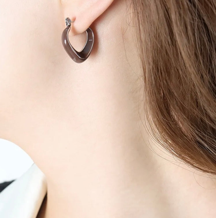 "BACH" silver colored hoop earrings with brown enamel