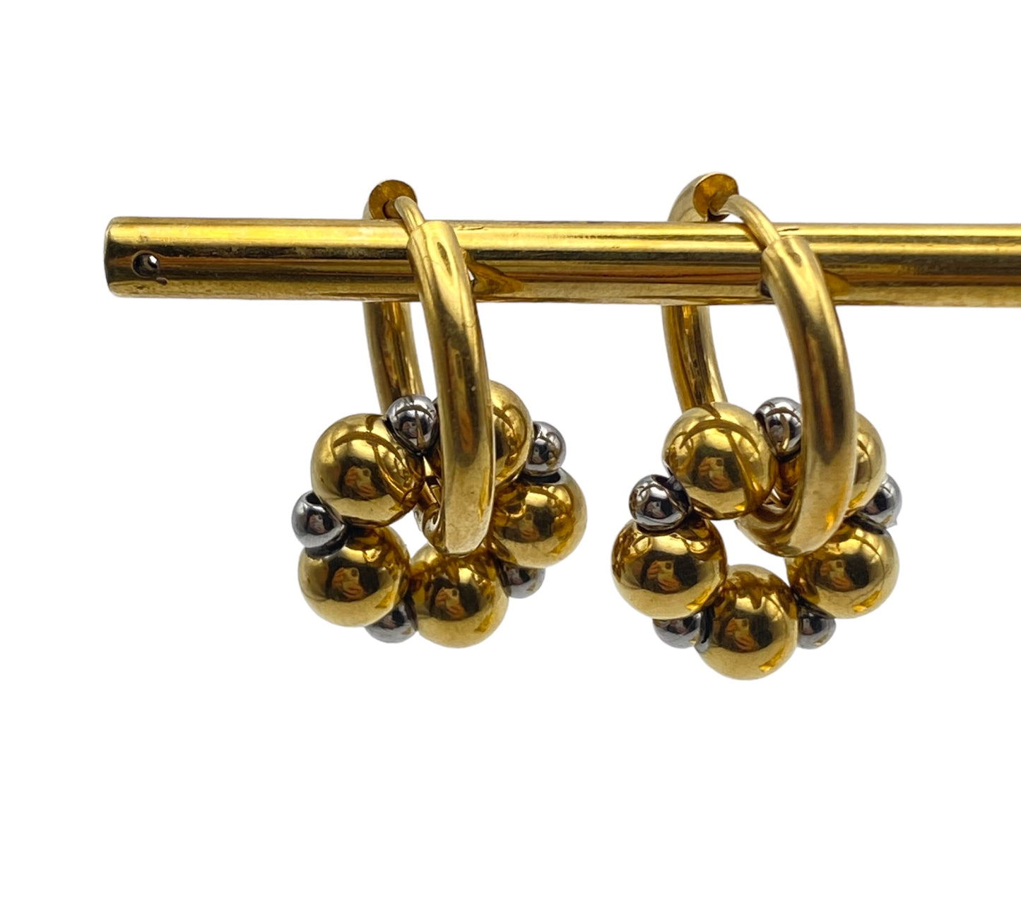 "WHEEL" gold plated hoop earrings with a dangling hoop of steel beads