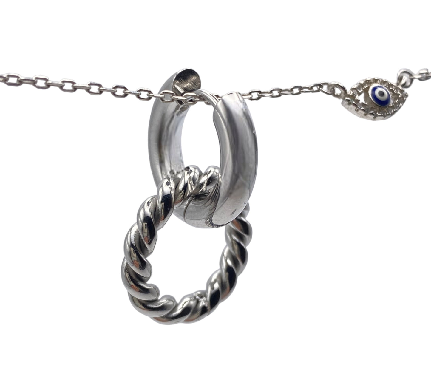 "WHISPER" silver colored hoops with a dangling round charm